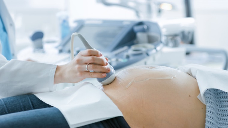 in-the-hospital-closeup-shot-of-the-doctor-doing-ultrasound-sonogram-picture-id996271140